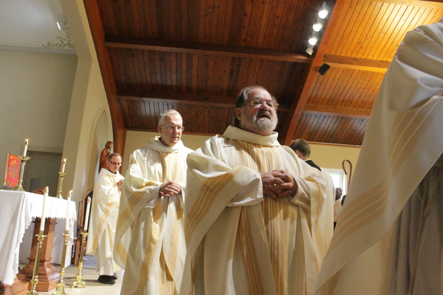 (From left) Father Michael Murphy, Father Christopher Cordes, Father David Means and other priests process into St. Brendan Church in Mexico to offer Mass with Bishop W. Shawn McKnight for the repose of the souls of the deceased priests and bishops of this diocese.